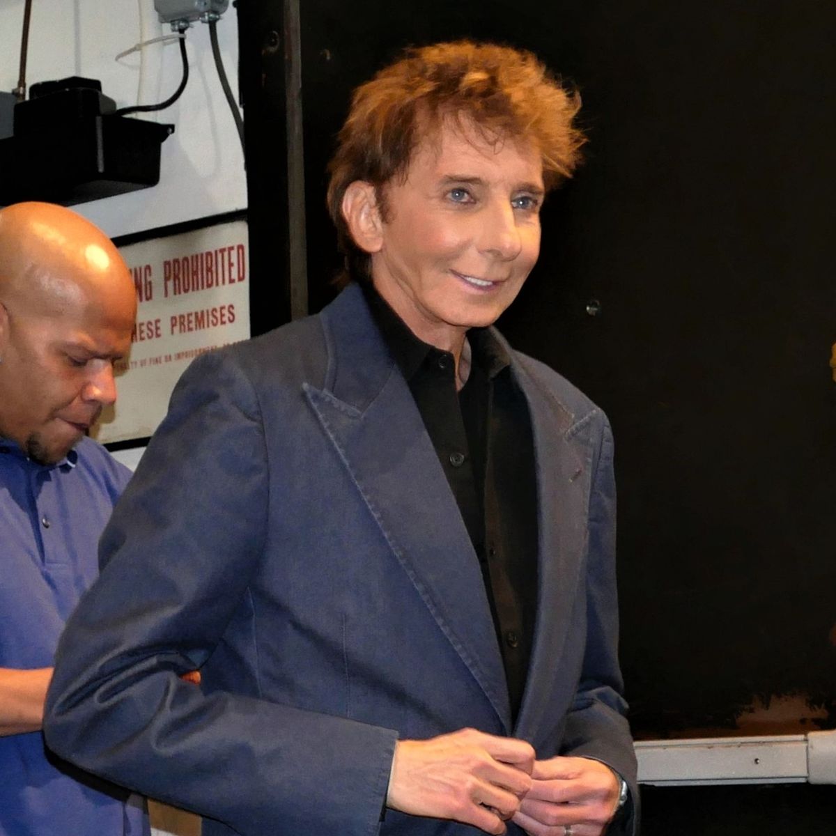 Why is Barry Manilow famous? How many top 10 hits did Barry Manilow